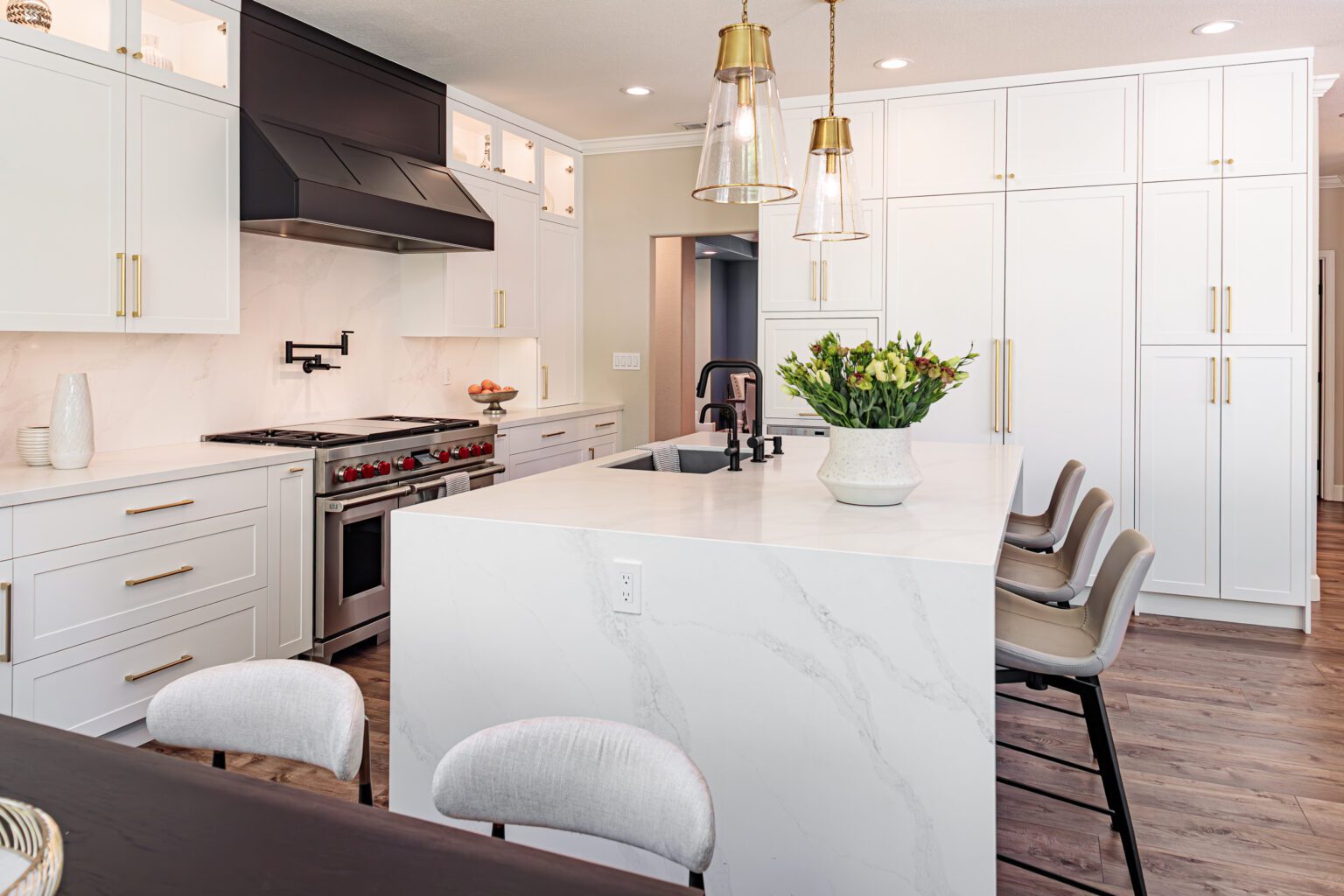 Best Countertop Materials for Busy Families inspiration. Large kitchen island with waterfall countertop